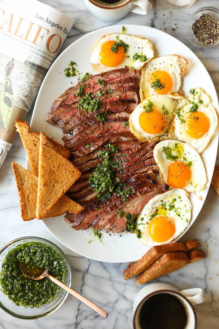 Best Ever Steak and Eggs-So quick, easy, and fancy pants without any of the hard work! Served with the most amazing herb sauce. SO SO GOOD.